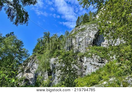Tavda caves (tavdinskiye peshchery) - karst mountain massif with an extensive chain of caves landmark of Altai mountains Russia Siberia