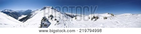The ascent to the mountain top in a Sunny snowy day. The ascent to Pastukhov mountain.