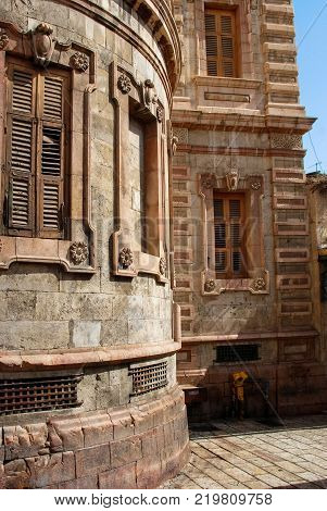 Vertical picture of the beautiful architecture of brick wall and wooden windows of Church of the Redeemer in the old city of Jerusalem Israel