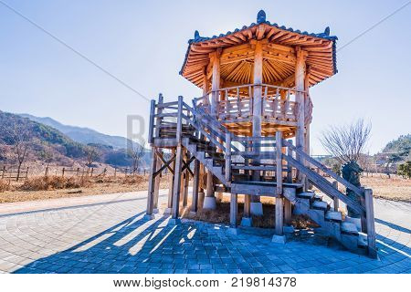 Two story wooden gazebo in a public park located near Geumsan, South Korea on a bright sunny morning