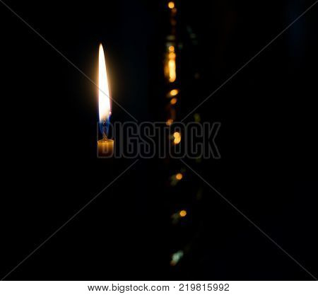 Flame of a candle on a black background