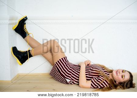 A portrait of a teen girl model in a stdio