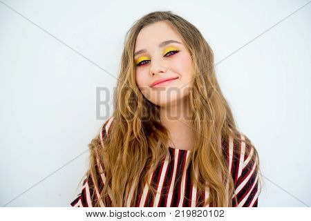 A portrait of a teen girl model in a stdio