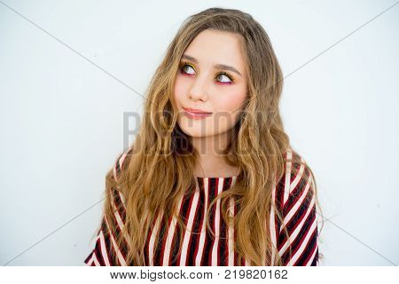 A portrait of a teen girl model in a stdio