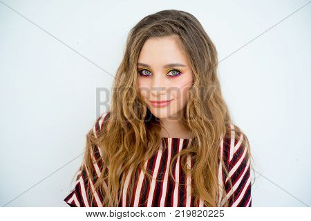 A portrait of a teen girl model in a stdio