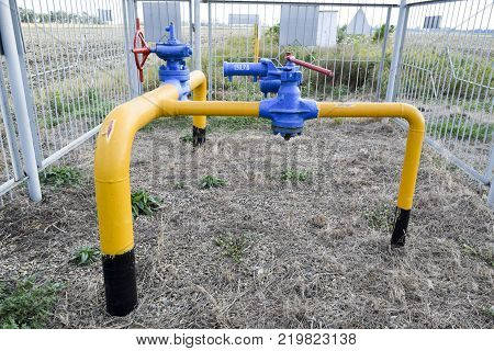 The latch on the underground gas pipeline protected with a fence.
