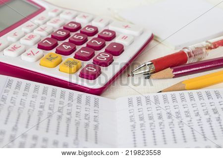 account passbook for management of business and check money with calculator