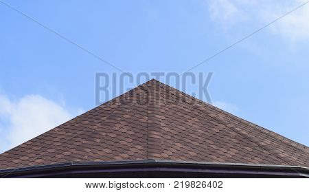 Decorative metal tile on a roof. Types of a roof of roofs.