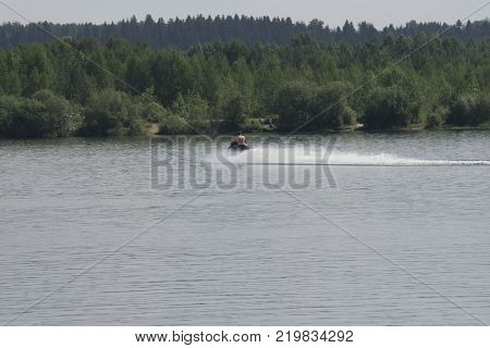 Young guy cruising on the atlantic ocean on a jet ski