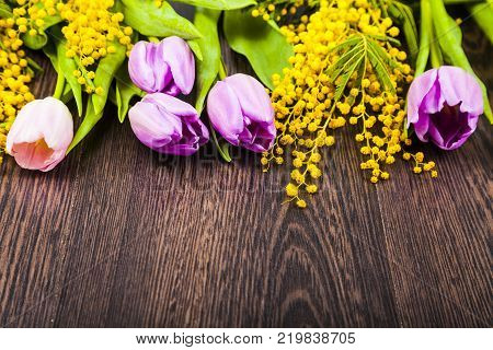 Mimosa And Paper On A Wooden Background