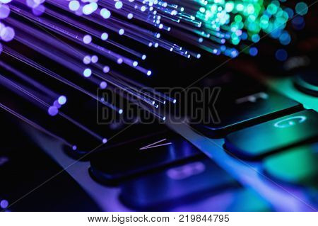 color fiber optical background with notebookk Fiber optics lights abstract background