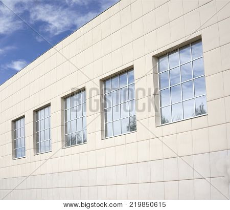 Building with facade cladding close up a lot and