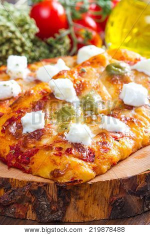 tris of mixed pizza on wood isolated on white with ingredients