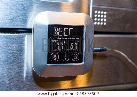 Beef roasting meat temperature conrol unit on silver oven.