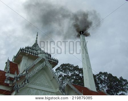 thai crematory with smoke on sad day