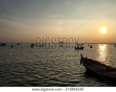 Many ships on the seawaves inthe twilight time in Thailand sea.