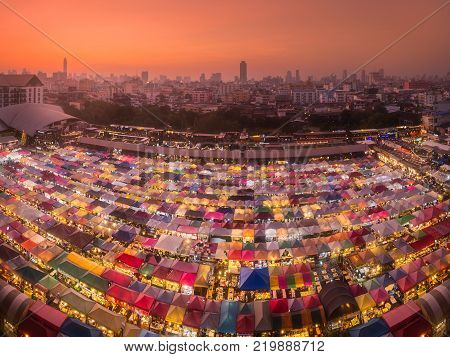 Ratchada Train Night market with street food and clothes in Bangkok , Thailand.