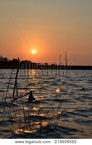 A beautiful Lake during sunset with the lake in the foreground and sun in the back