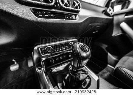 BERLIN - DECEMBER 21, 2017: Showroom. The shift knob of mid-size luxury pickup truck Mercedes-Benz X-Class X220d 4Matic. Black and white. Since 2017.