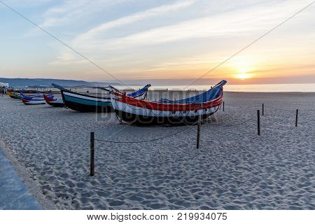 fishing boat on the beach at sunset, Nazare, Portugal