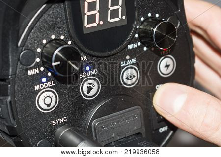 hand adjusts the flash light candlestick behind