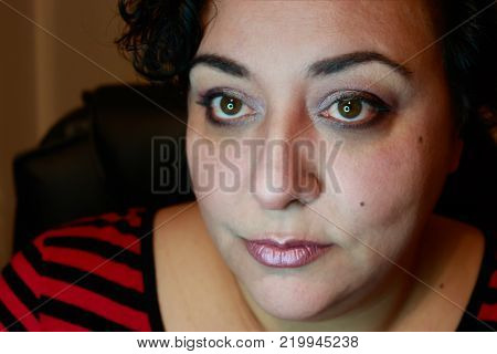 Close up view of ethnic woman with short hair