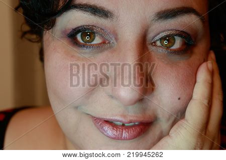 Close up view of ethnic woman with short hair showing happy expression