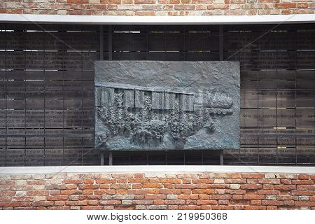 VENICE, ITALY - SEPTEMBER 23, 2017: Venetian Ghetto, wall with carved relief on bronze plate, memorial to Venetian Jews.Ghetto was founded in 1516 in the times of the Republic of Venice. It was the first ghetto in the world