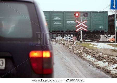 Gomel, Belarus - December 28, 2017 railway crossing with red symphore