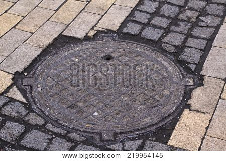 sewer and drainage manholes on the roads and sidewalks