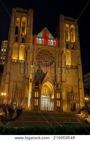 Editorial SS: San Francisco, California - December 28, 2017: Exterior of Grace Cathedral Churchlandmarks, cemetery, tourism, design, architectural, vertical, usa, ghiberti doors, stairs, frontier, labyrinth, history, art, catholic, gothic, holiday lights,