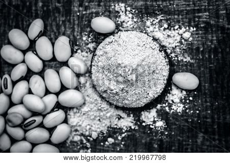 Close Up Of Ayurvedic Herb Kuanch,cowhage,mucuna Pruriens With Powder.