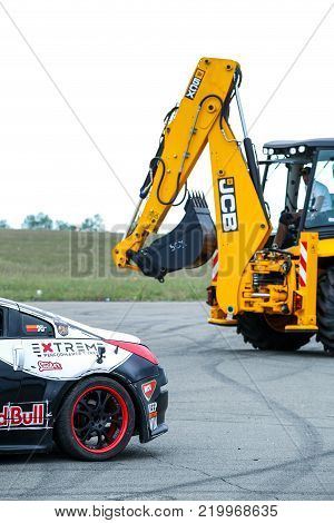 KIEV, UKRAINE - MAY 20: Ukrainian Drift Champion's Alex Grinchuk  Nissan 350Z and agricultural machine JCB , May 20, 2017, Aviafest at Chayka airfield in Kiev, Ukraine