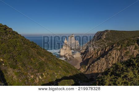 Praia da Ursa beach with rocks in Portugal.