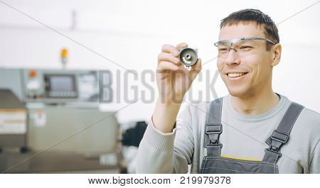 quality control part metal worker machine male
