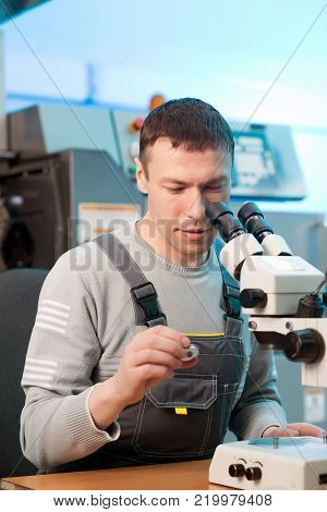 quality control part metal worker machine male