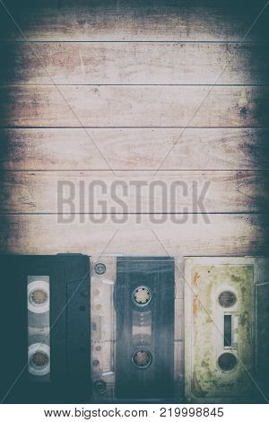 Old music cassettes on a wooden table