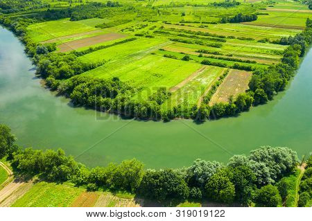 Beautiful Countryside Landscape In Croatia, Kupa River Meandering Between Agriculture Fields, Shot F