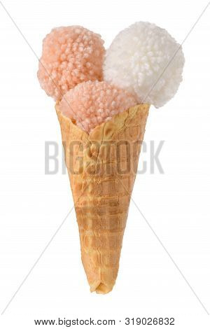 Coral  And White Color Fluffy Wool Pom Poms On Ice Cream Waffle Cone On White Background.