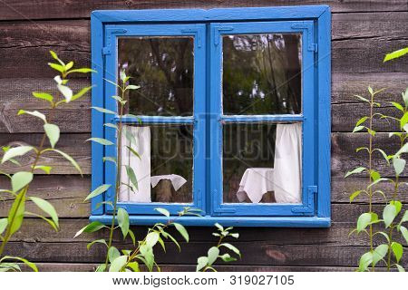 Blue Window Of Old Ethno House In Open-air Museum, Polish Folk Culture. Poland, Europe