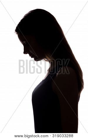 Young Woman Look Down With Flowing Hair - Vertical Silhouette
