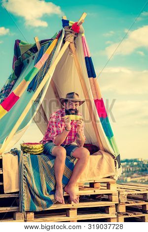 Handsome Bearded Man Having Fun In Adventure Park. Hovel Decorated Party. Story In Hovel. Summer Cam