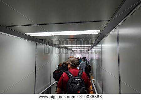 Orlando, Fl/usa-8/22/19: People Waiting On A Jetway To Board An Airplane.