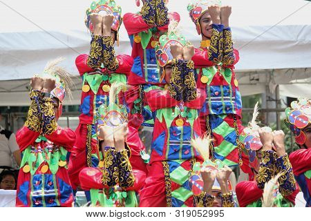Davao City, Philippines-august 2014: Kadawayan Streetdancing Participants In Colorful Costumes Perfo