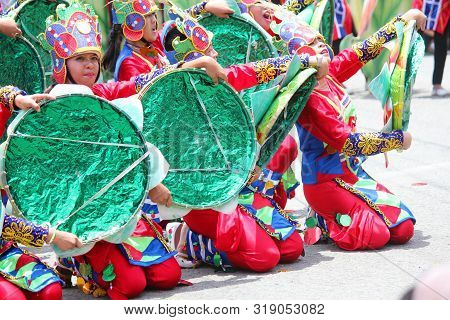Davao City, Philippines-august 2014: Parade Participants In Their Colorful Props At The Streetdancin
