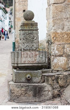 Stone Fountain In Which You Can Read The Date Of The Founding Of Mongui