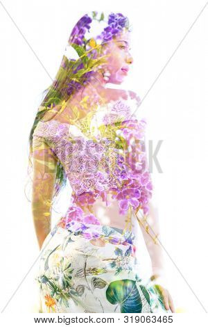 Double exposure of a beautiful woman's torso and profile combined with branches and healthy leaves, on isolated white background