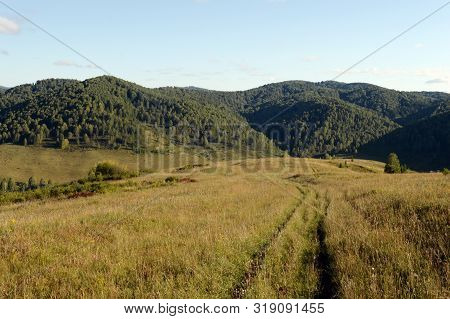 Landscape In The Vicinity Of The Taiga Village Generalka In The Mountains Of The Altai Territory. We