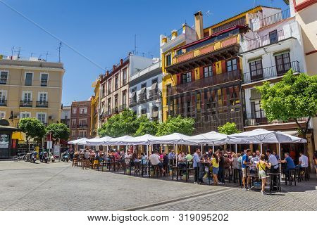 Sevilla, Spain - May 14, 2019: People Having A Drink At The Plaza Del Salvador In Sevilla, Spain