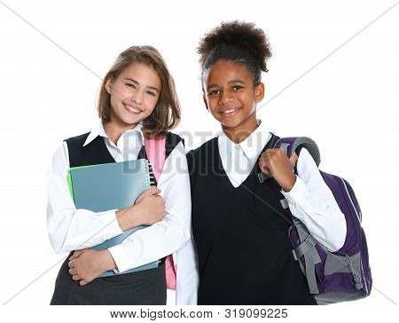 Happy Girls In School Uniform On White Background